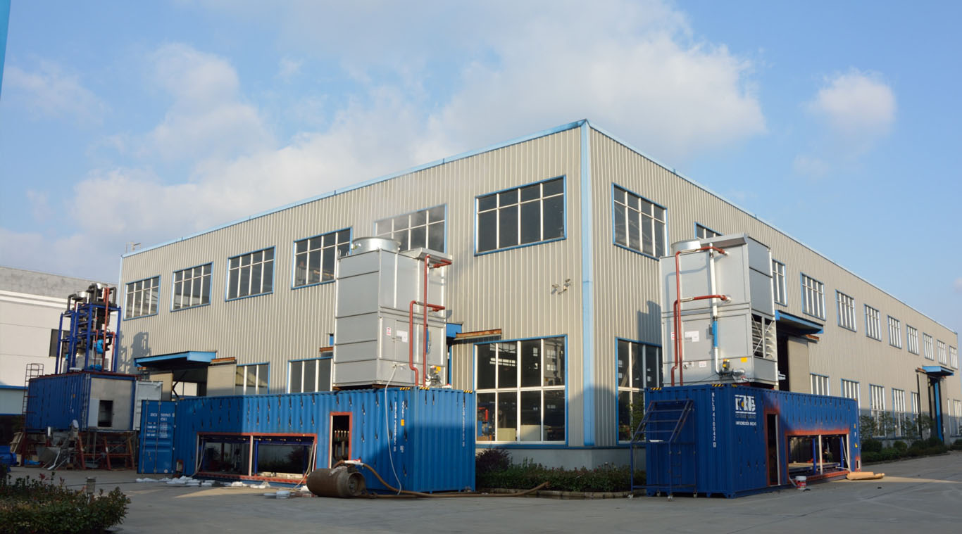 Containerized direct refrigeration block ice machine